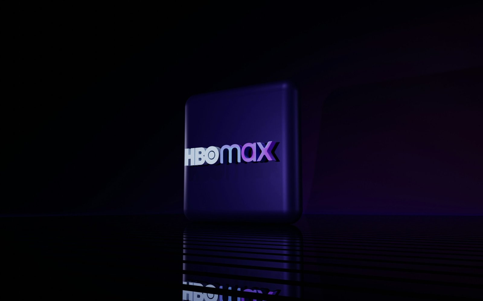 Hbo max logo on a dark reflective surface