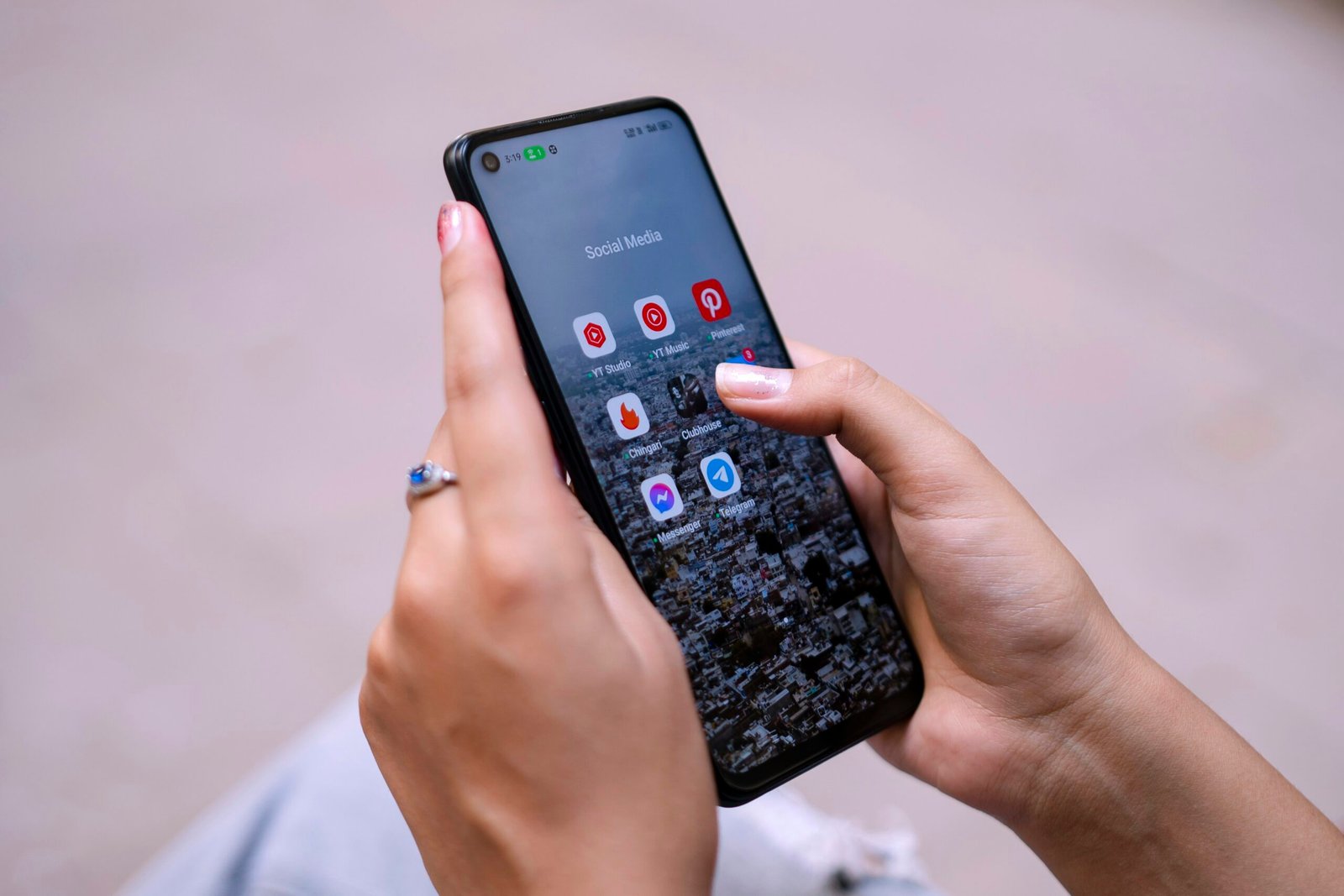 a woman holding a cell phone in her hand