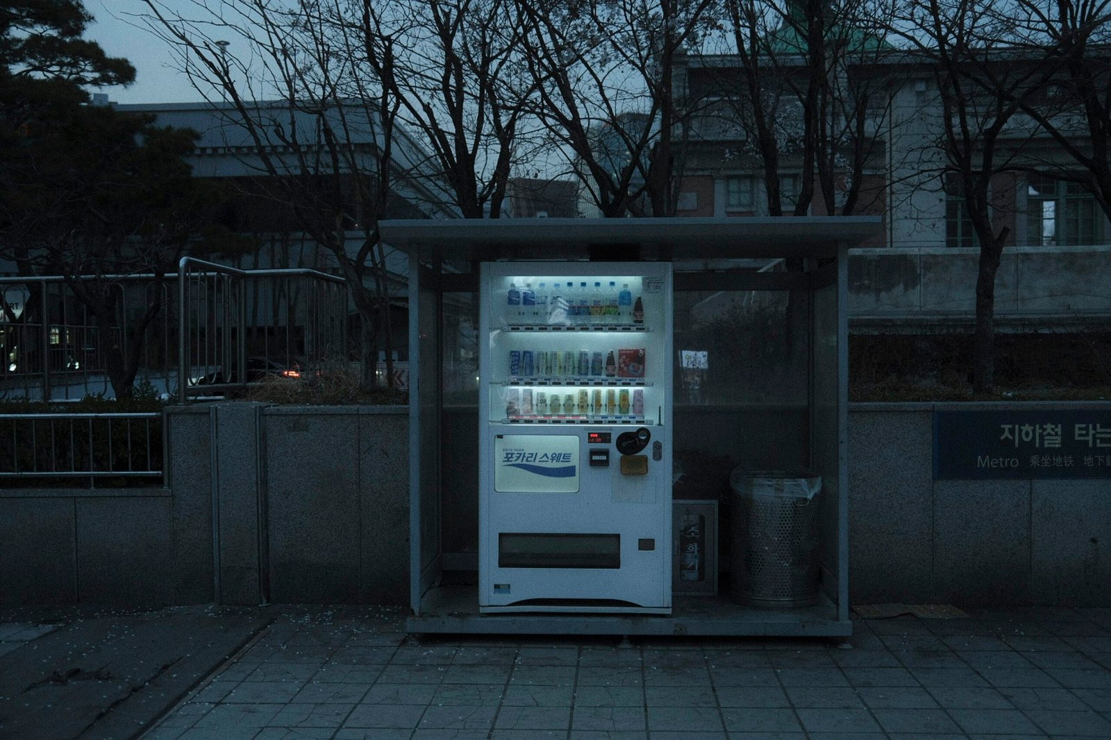 a vending machine sitting on the side of a road