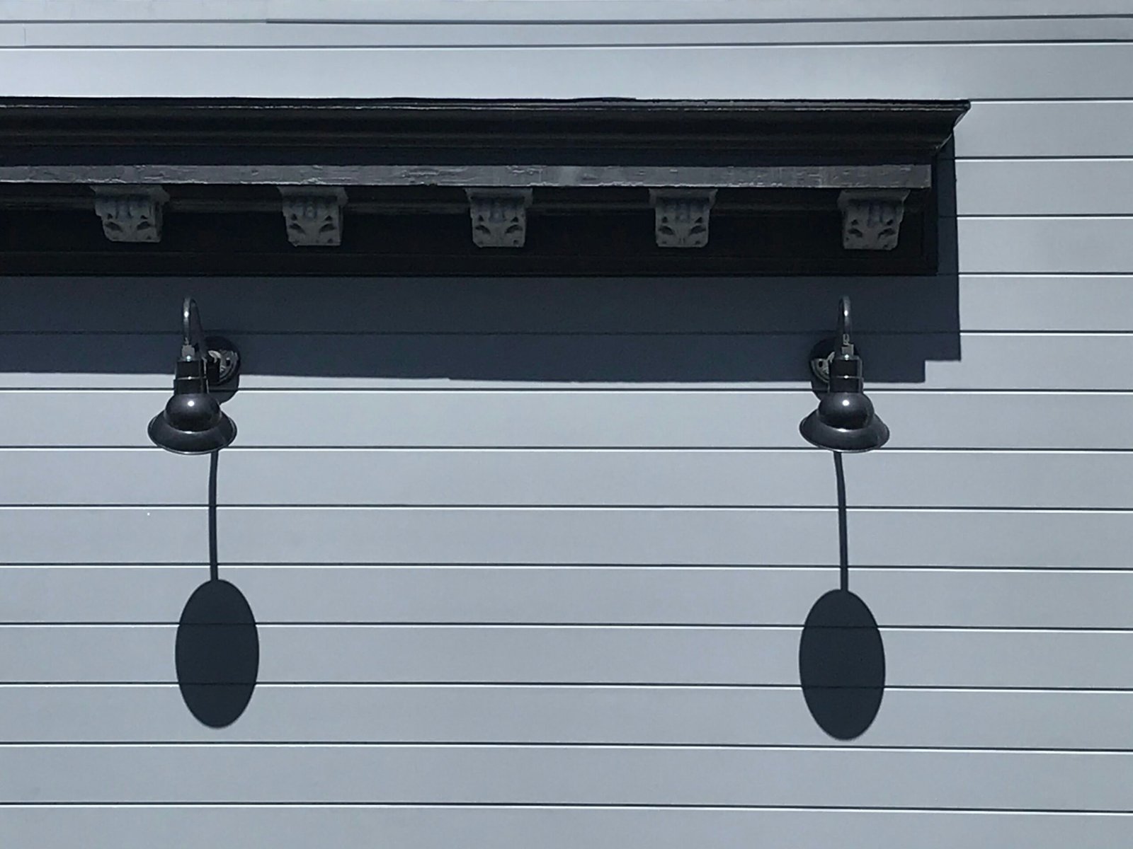 black metal wall lamp turned off