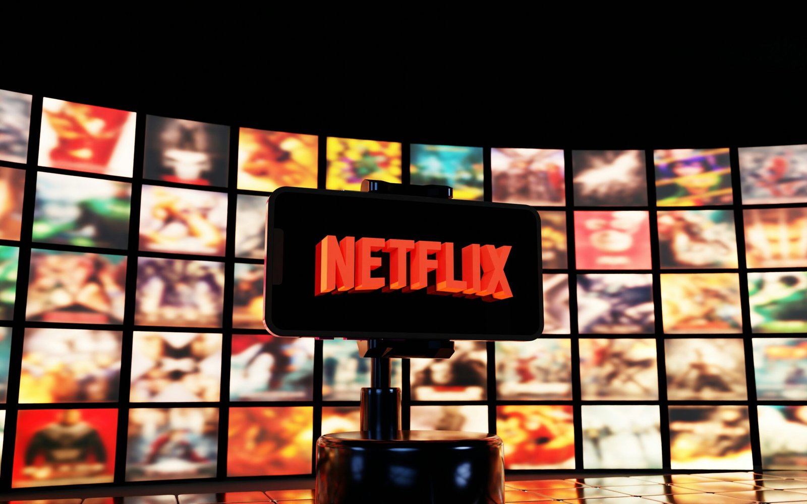 Netflix logo displayed on a screen with movie posters.