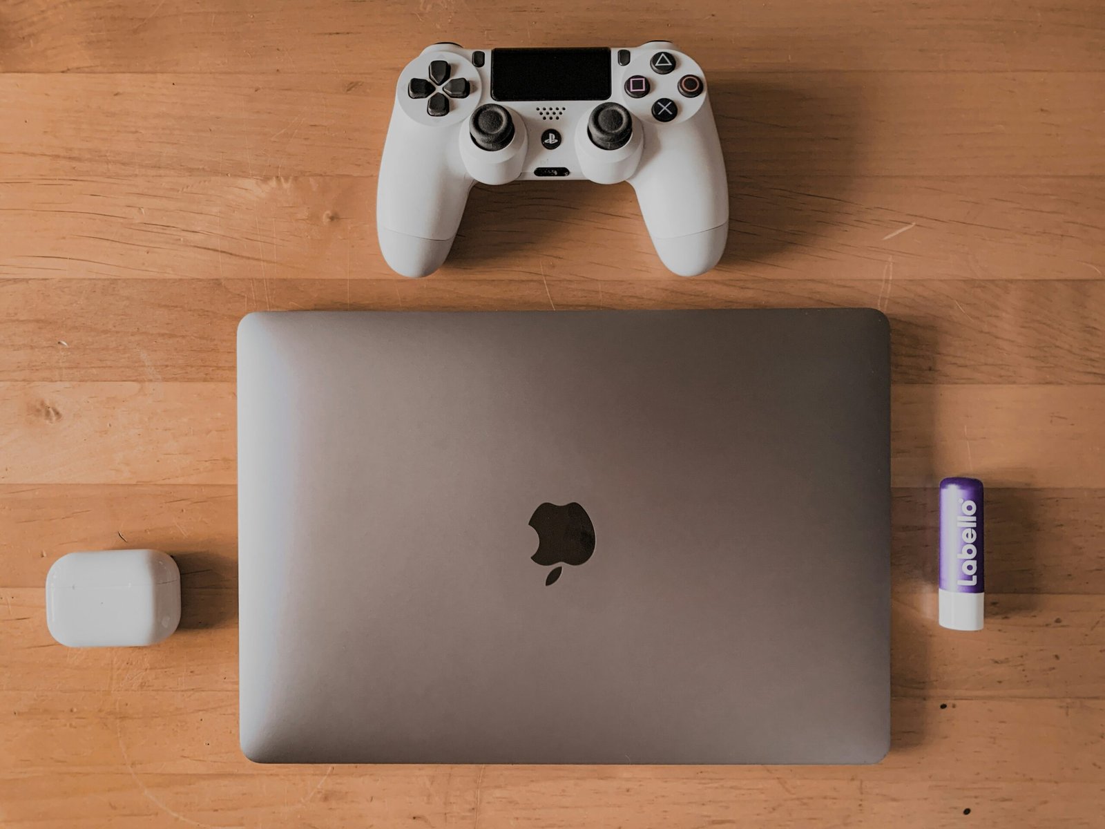 a laptop computer sitting on top of a wooden table