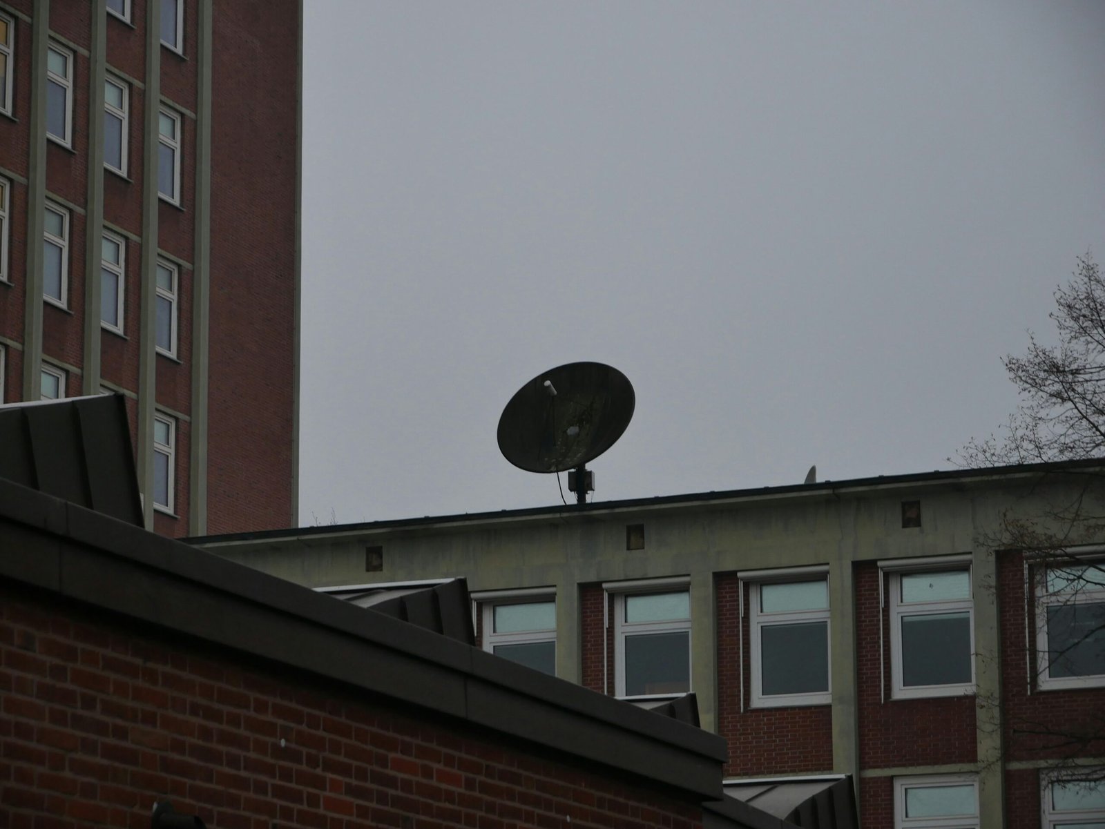 a satellite dish sitting on top of a building