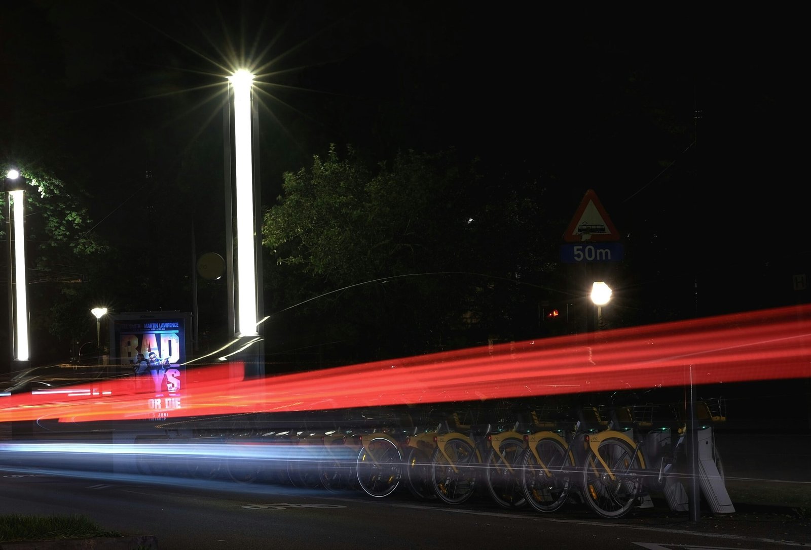 a long exposure photo of a street at night