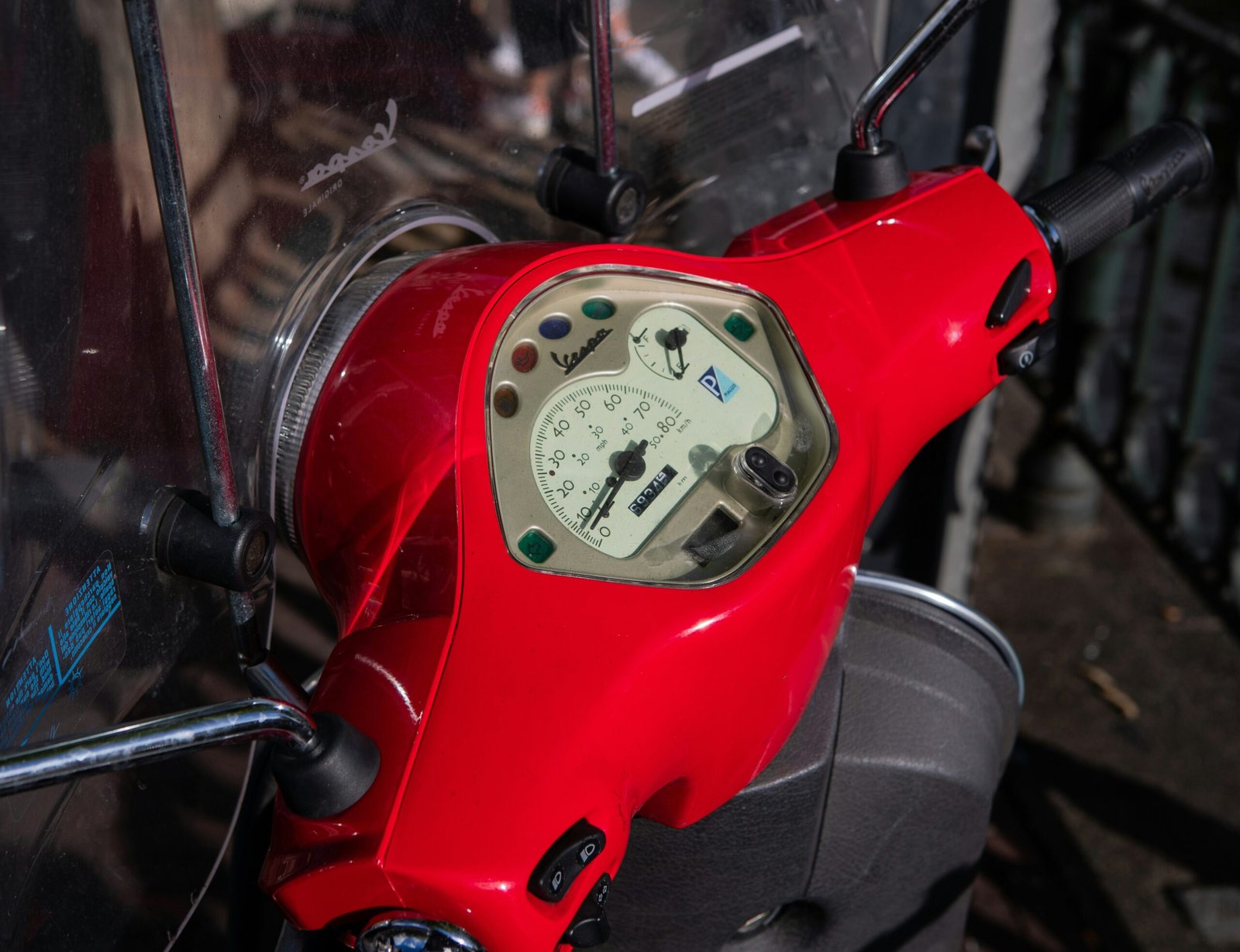 red motorcycle with white gauge