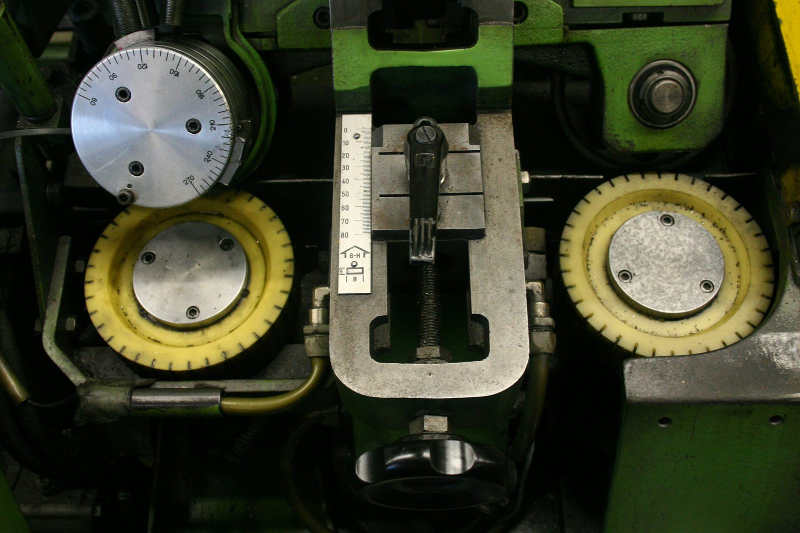 Close-up of industrial machinery with gears and dials.