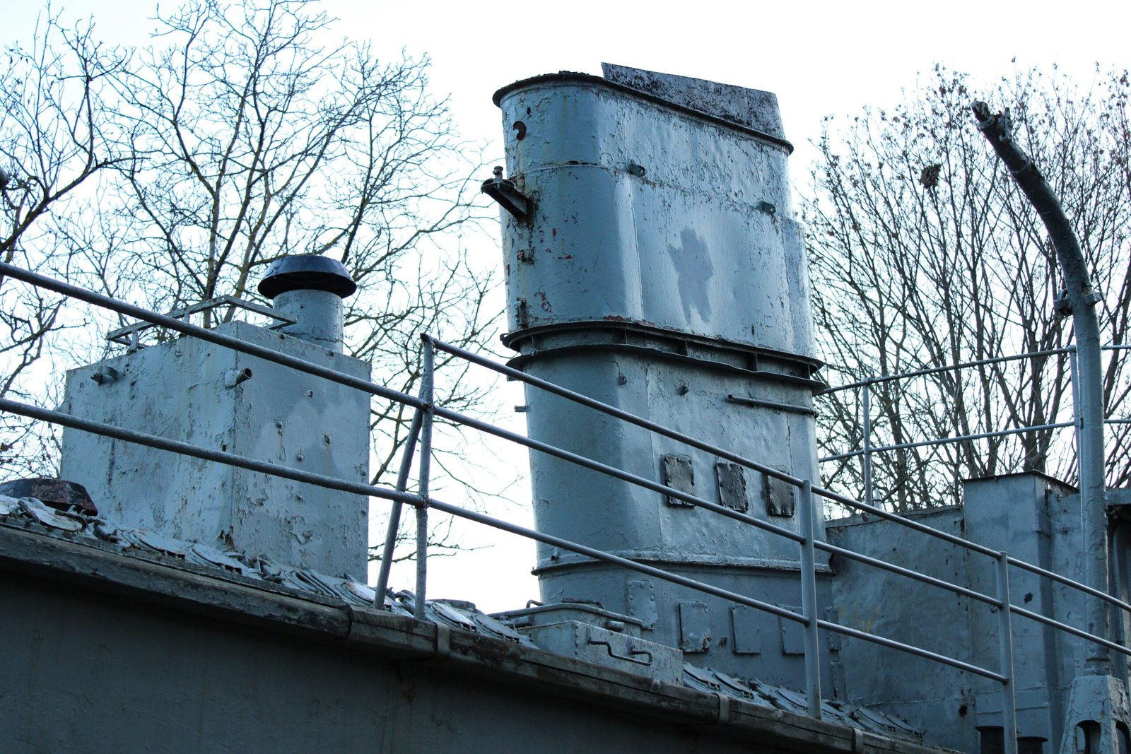an old factory building with a lot of smoke coming out of it