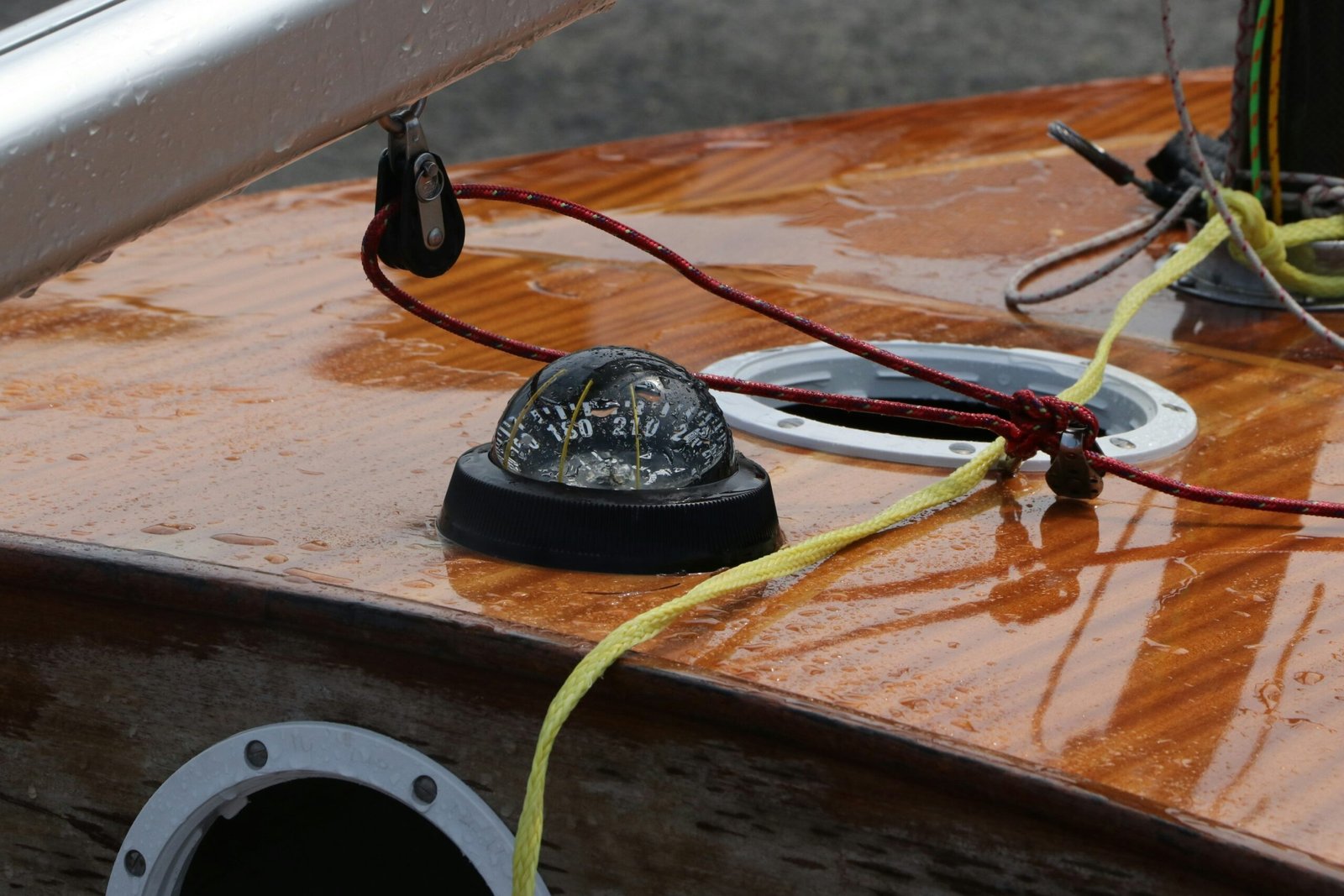 a black and red circular object with wires coming out of it
