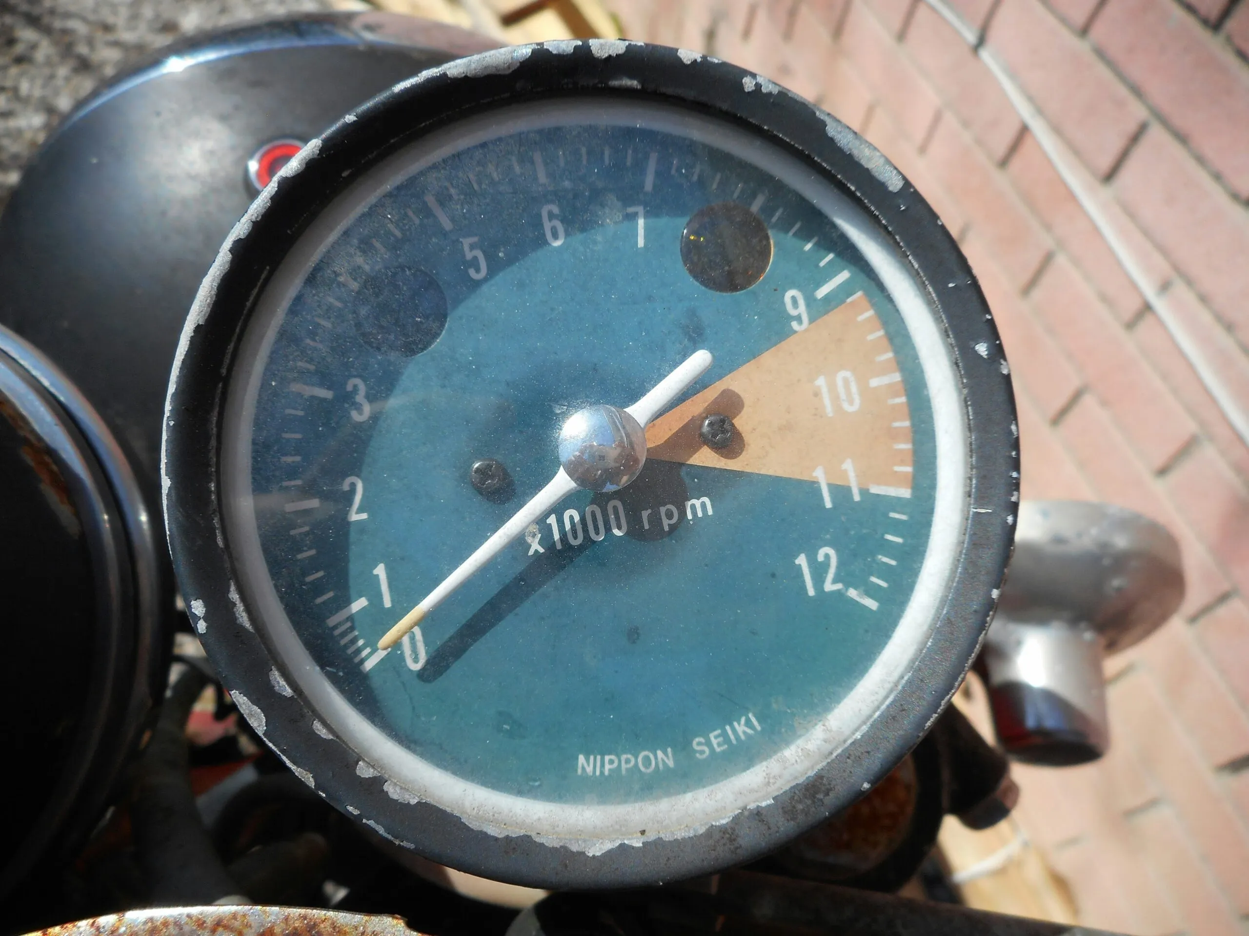 a close up of a speedometer on a motorcycle
