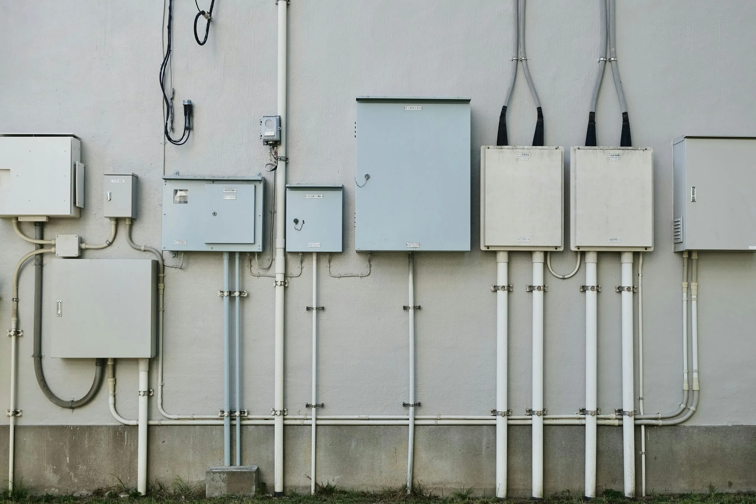 a bunch of electrical wires are attached to a wall