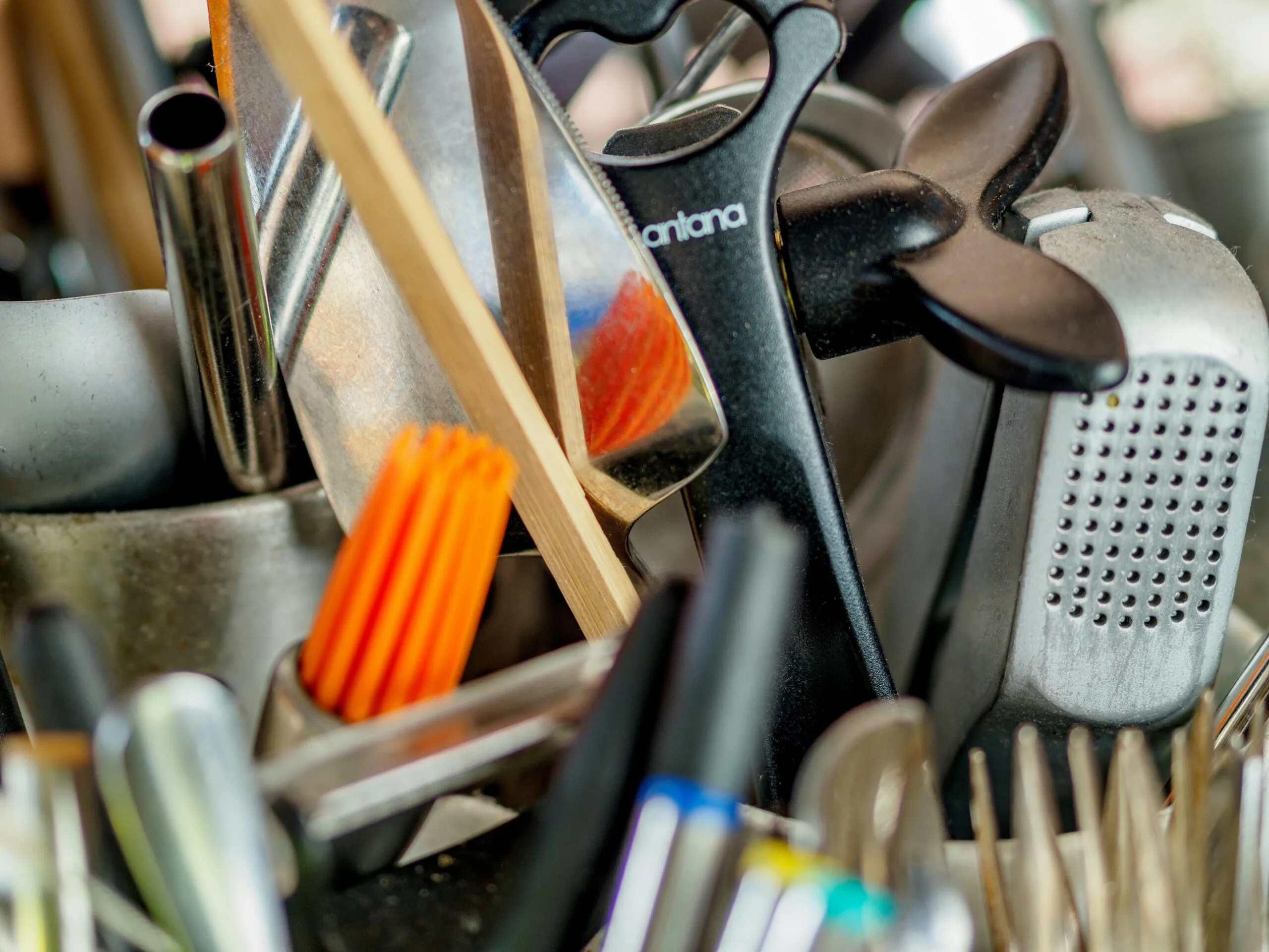 a pile of kitchen utensils and other kitchen utensils