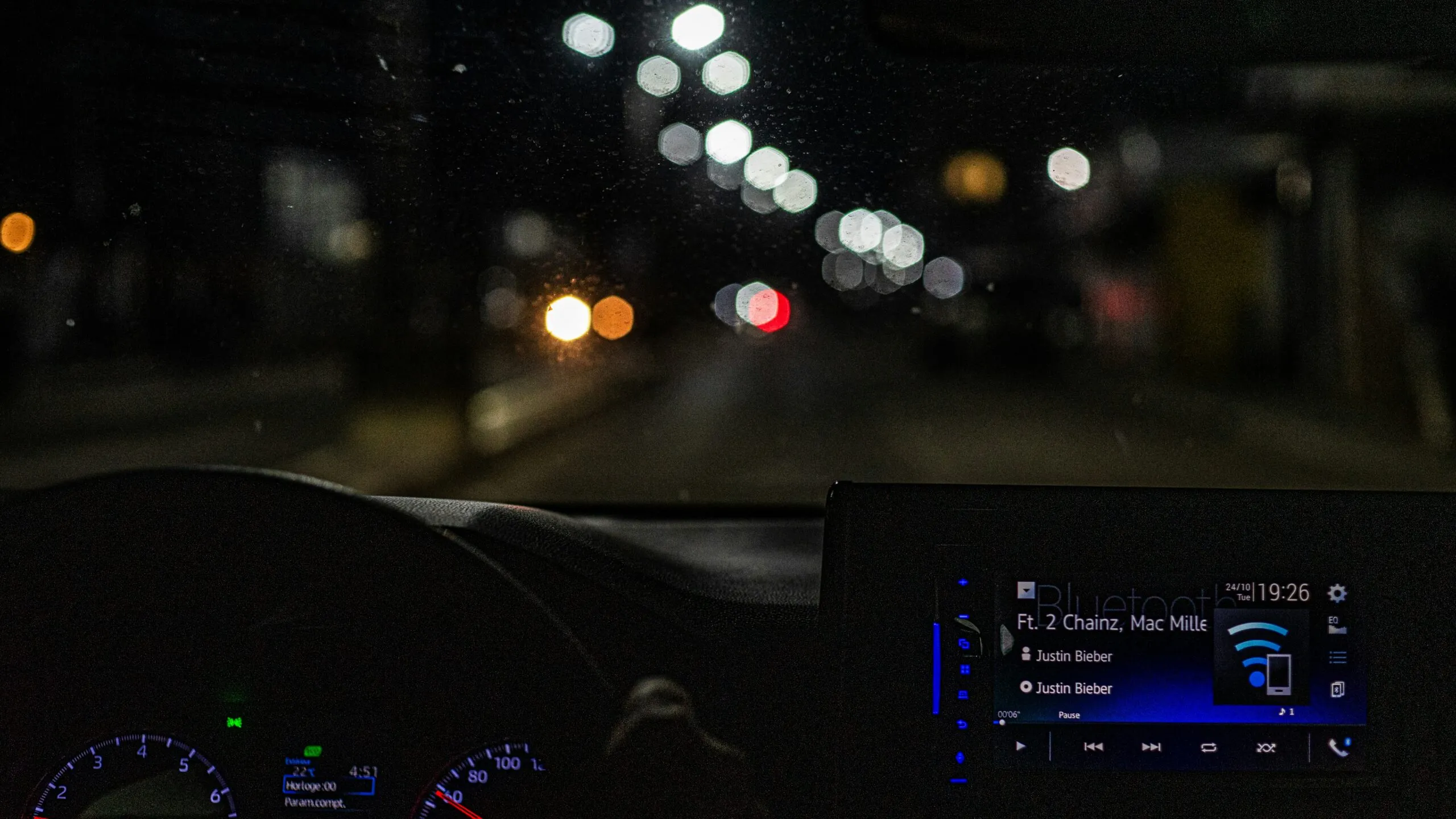 the dashboard of a car at night time