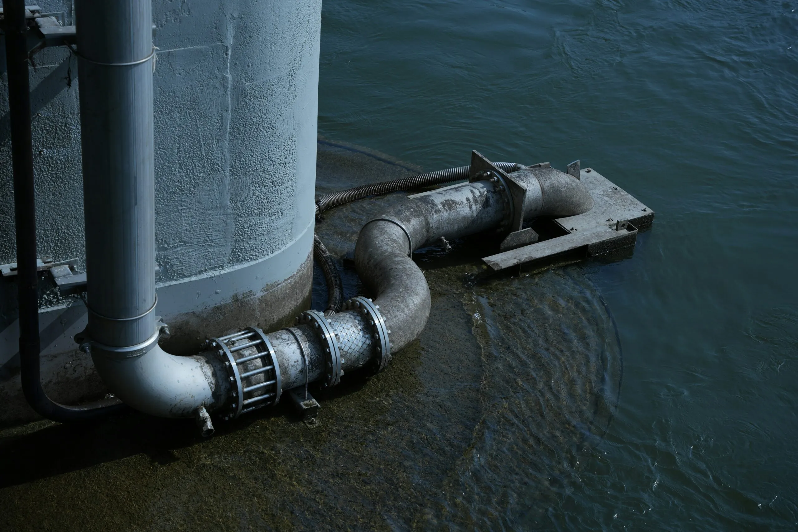 Pipe and water outlet are connected to a structure.