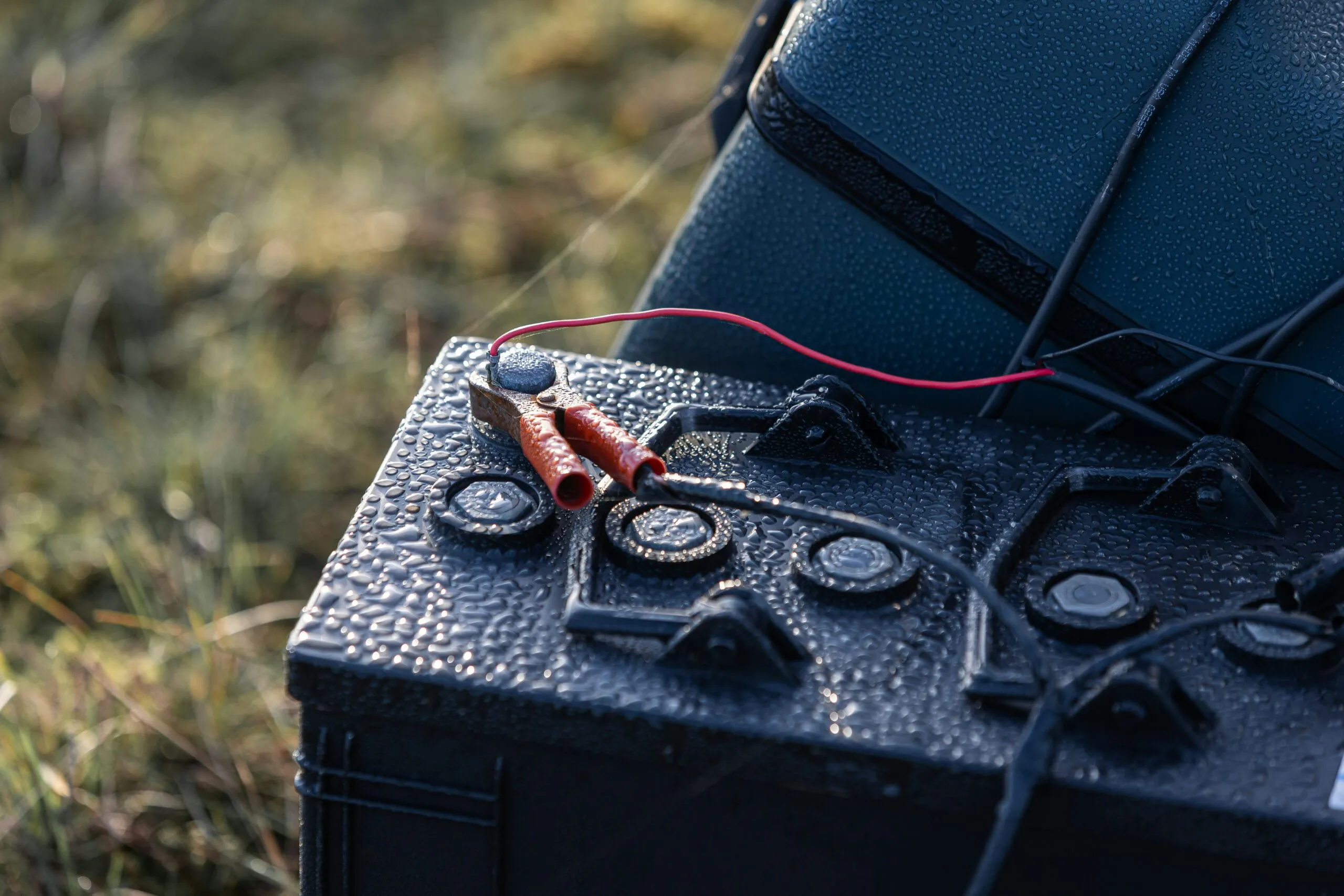 A close up of an electronic device in the grass
