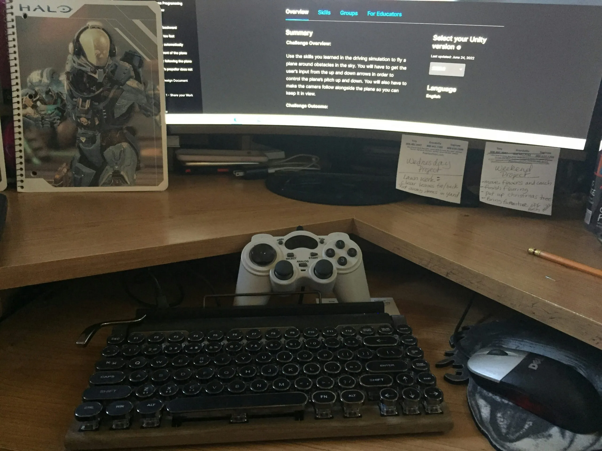 a computer desk with a keyboard and a monitor