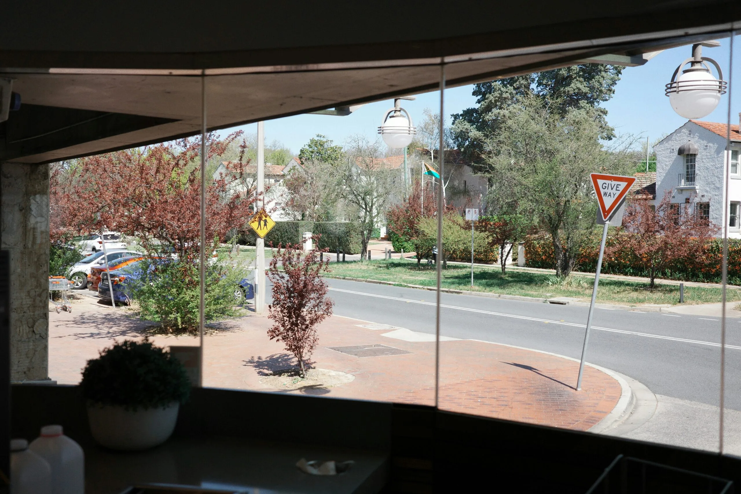 a view of a street through a window