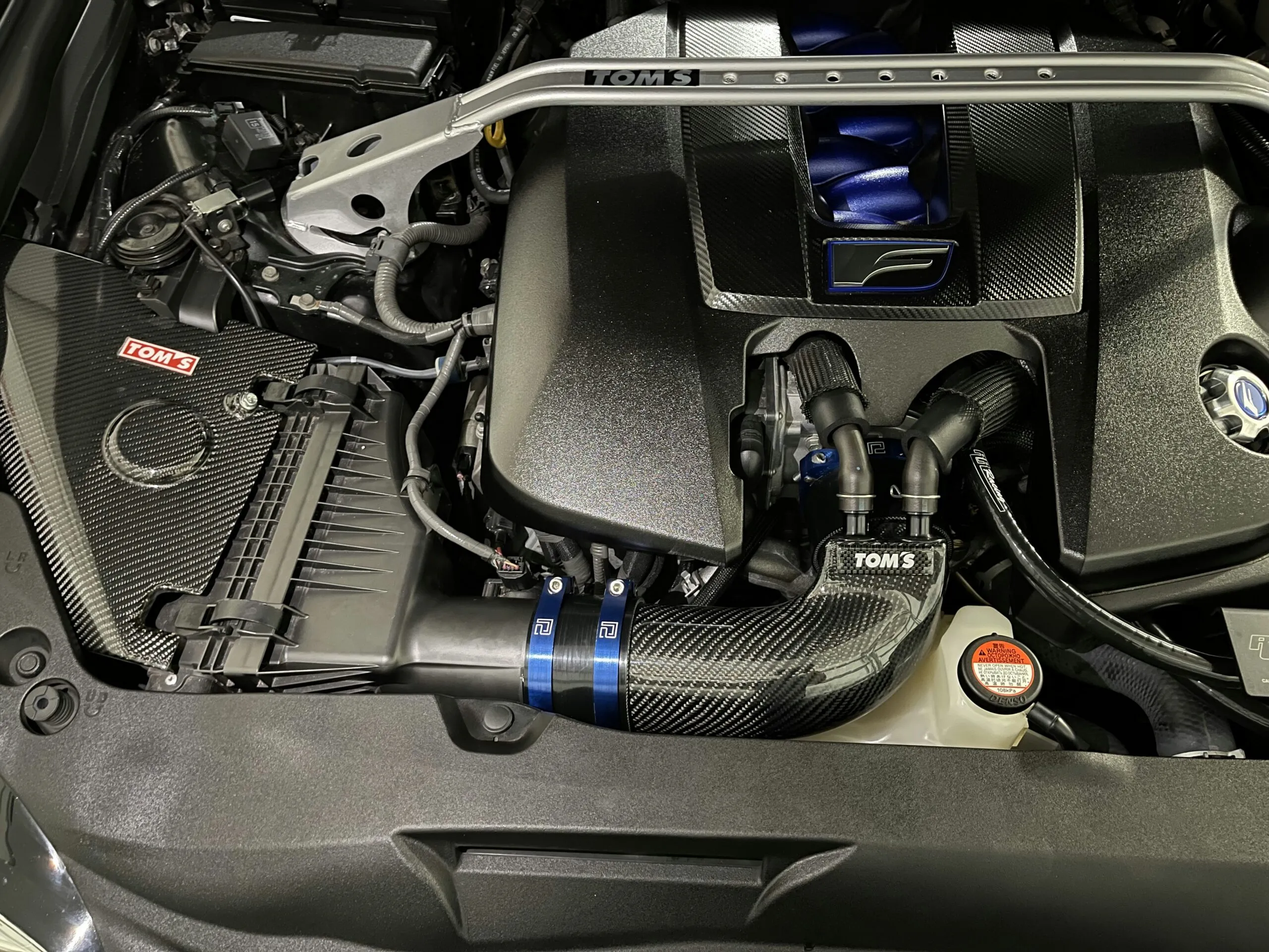 the engine compartment of a car with the hood up