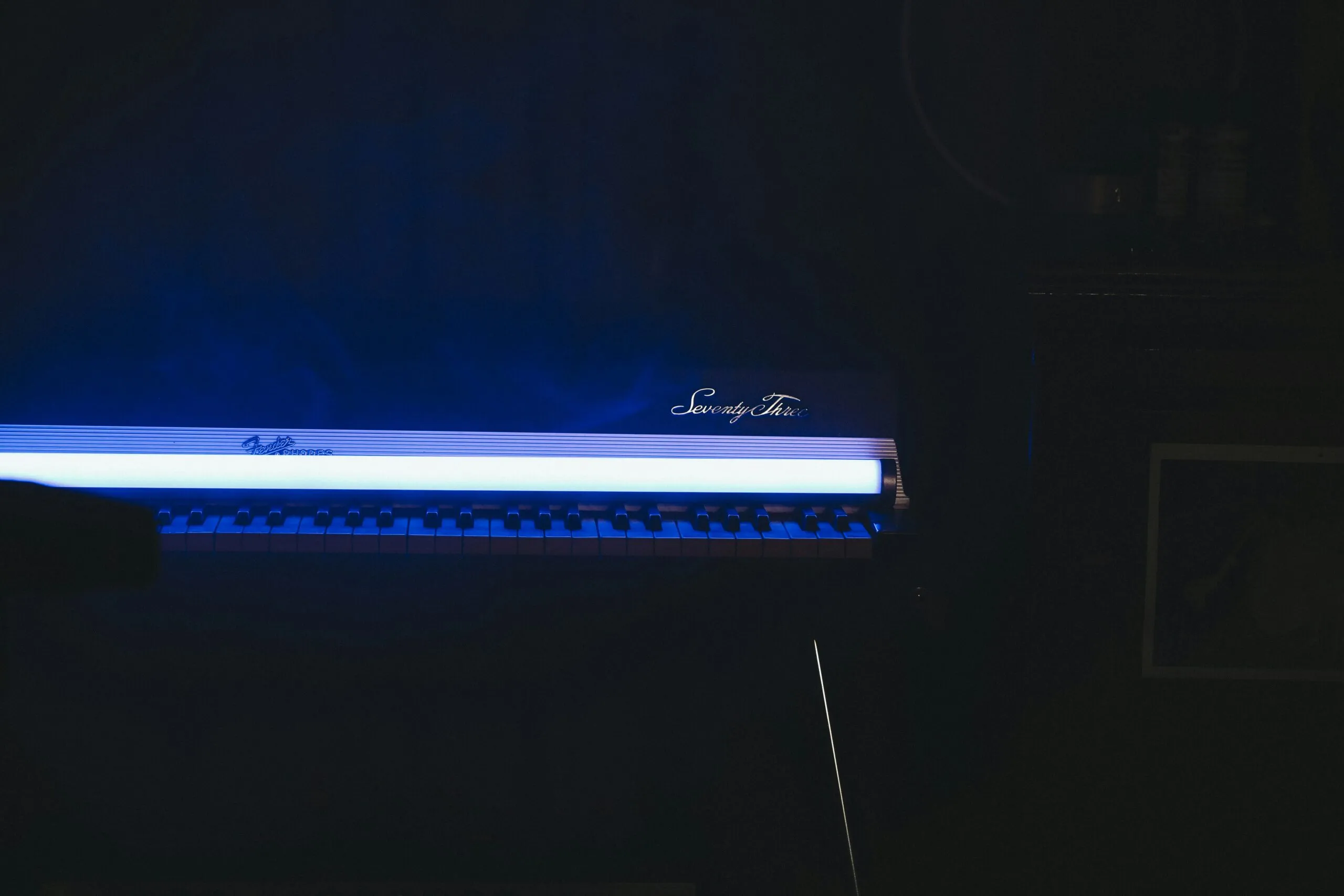 a black room with a blue light in it