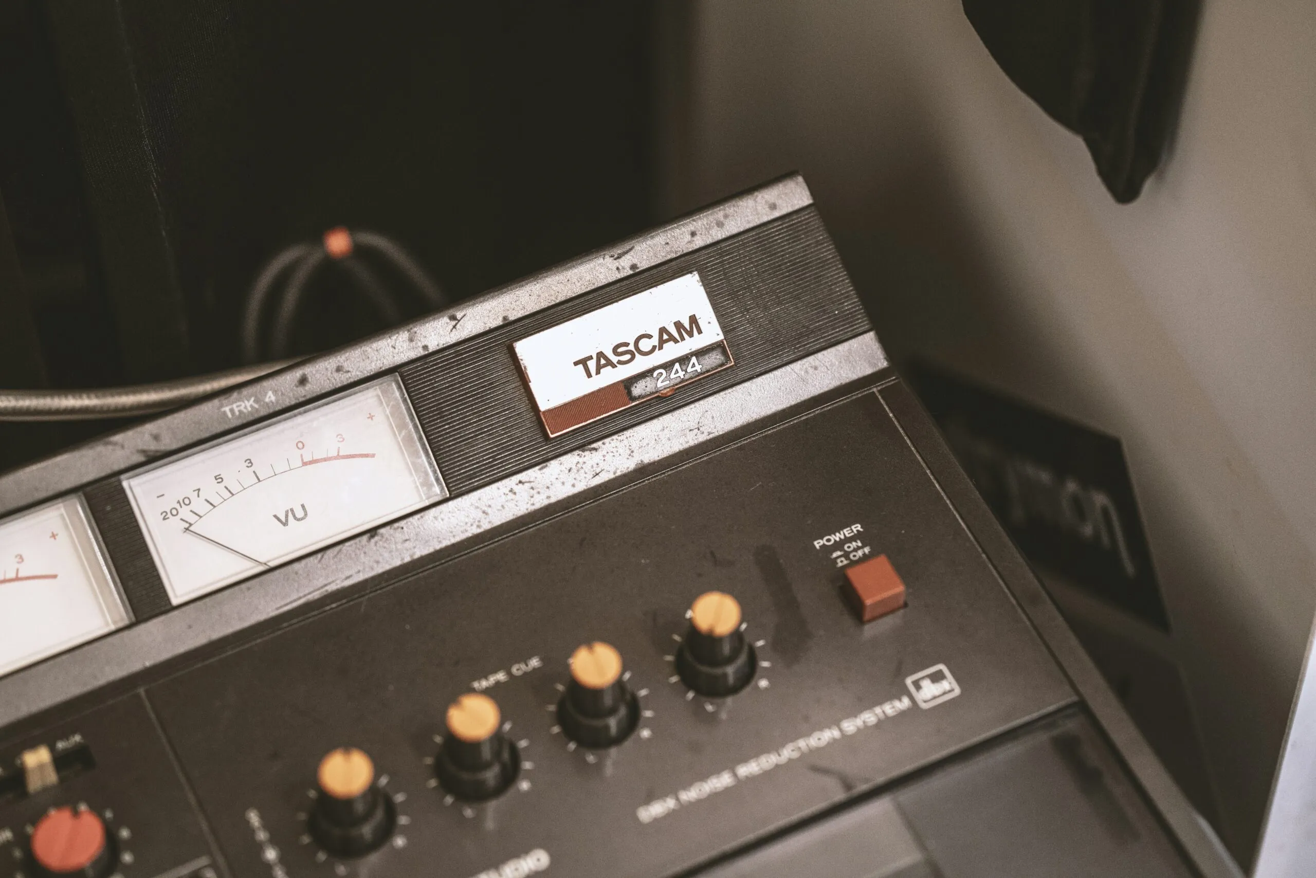black Tascam electronic component beside wall