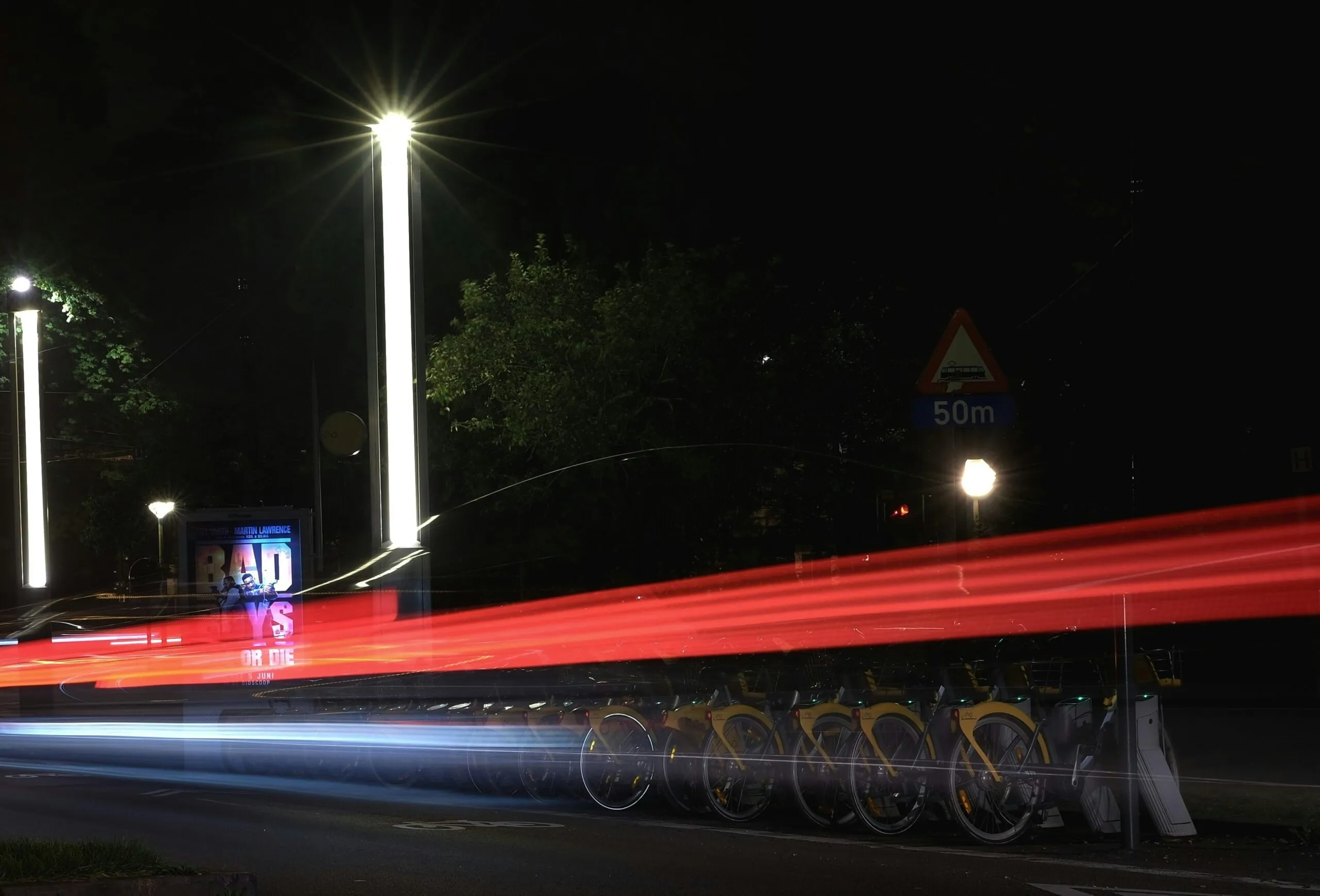 a long exposure photo of a street at night