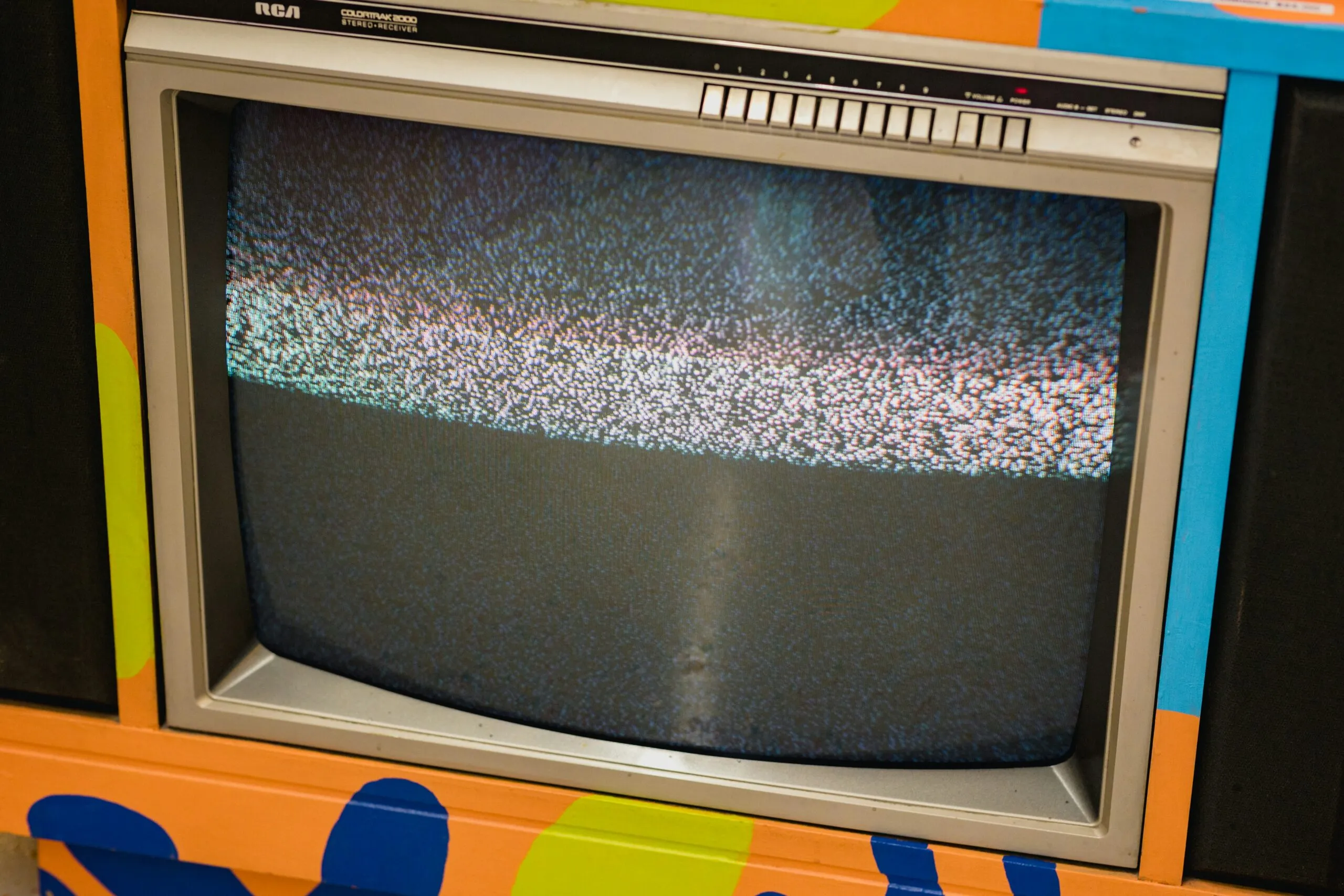 an old television sitting on top of a table