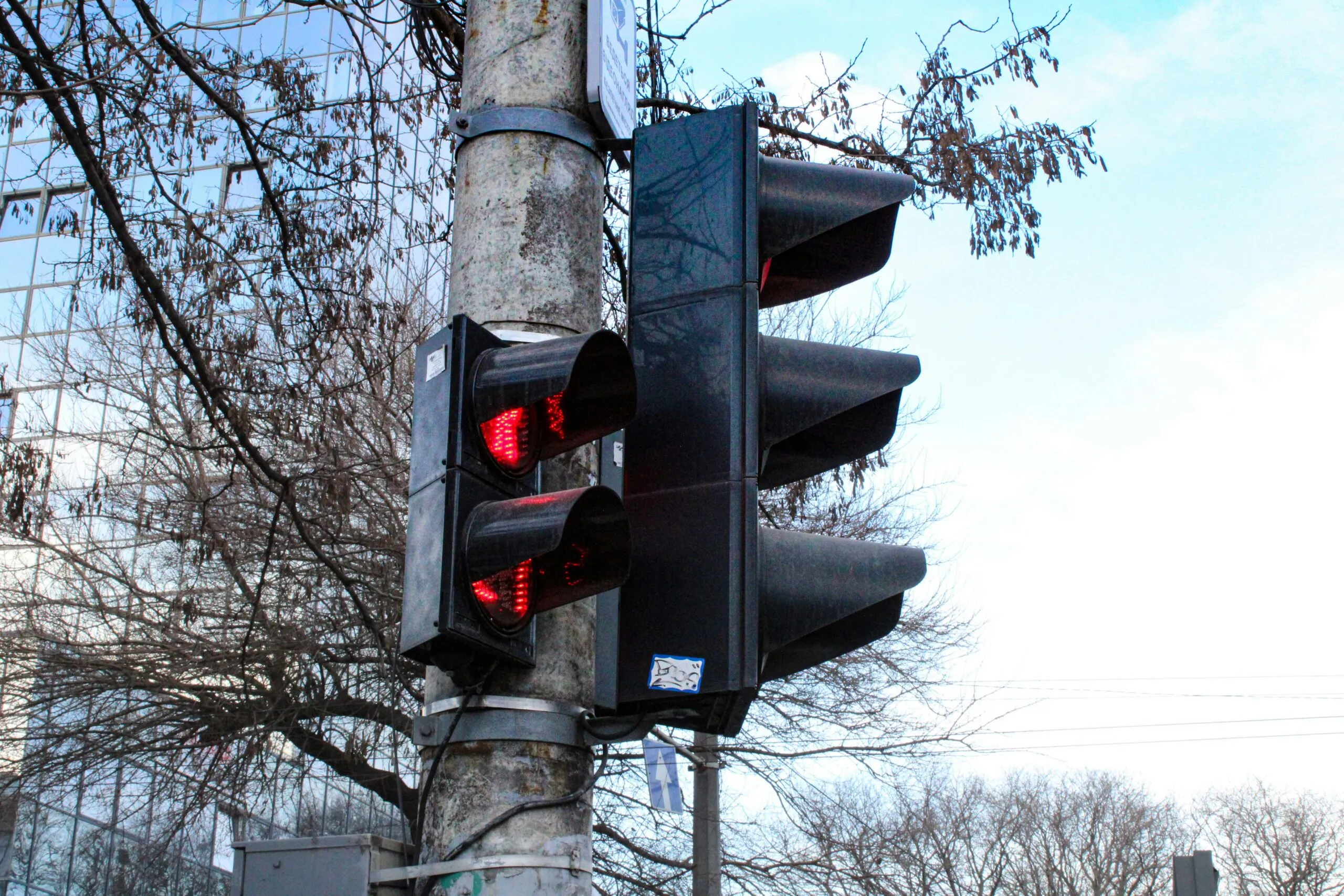 a traffic light on a pole in a city