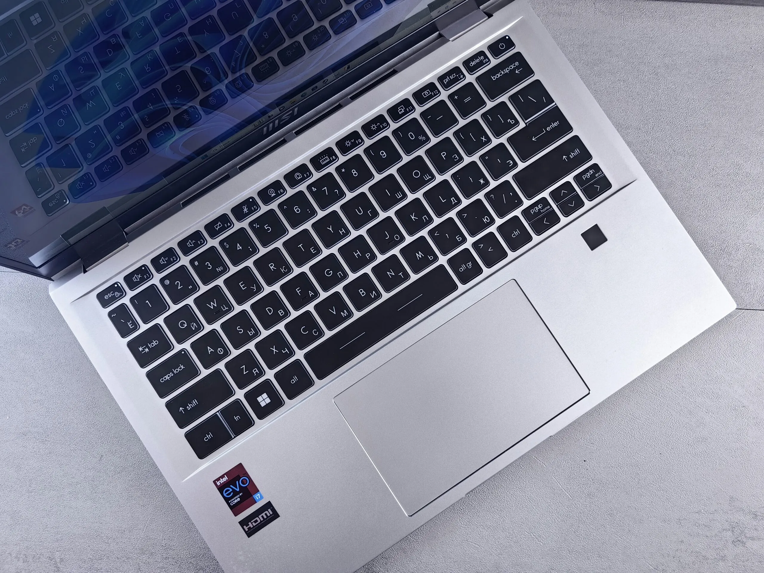 an open laptop computer sitting on top of a table