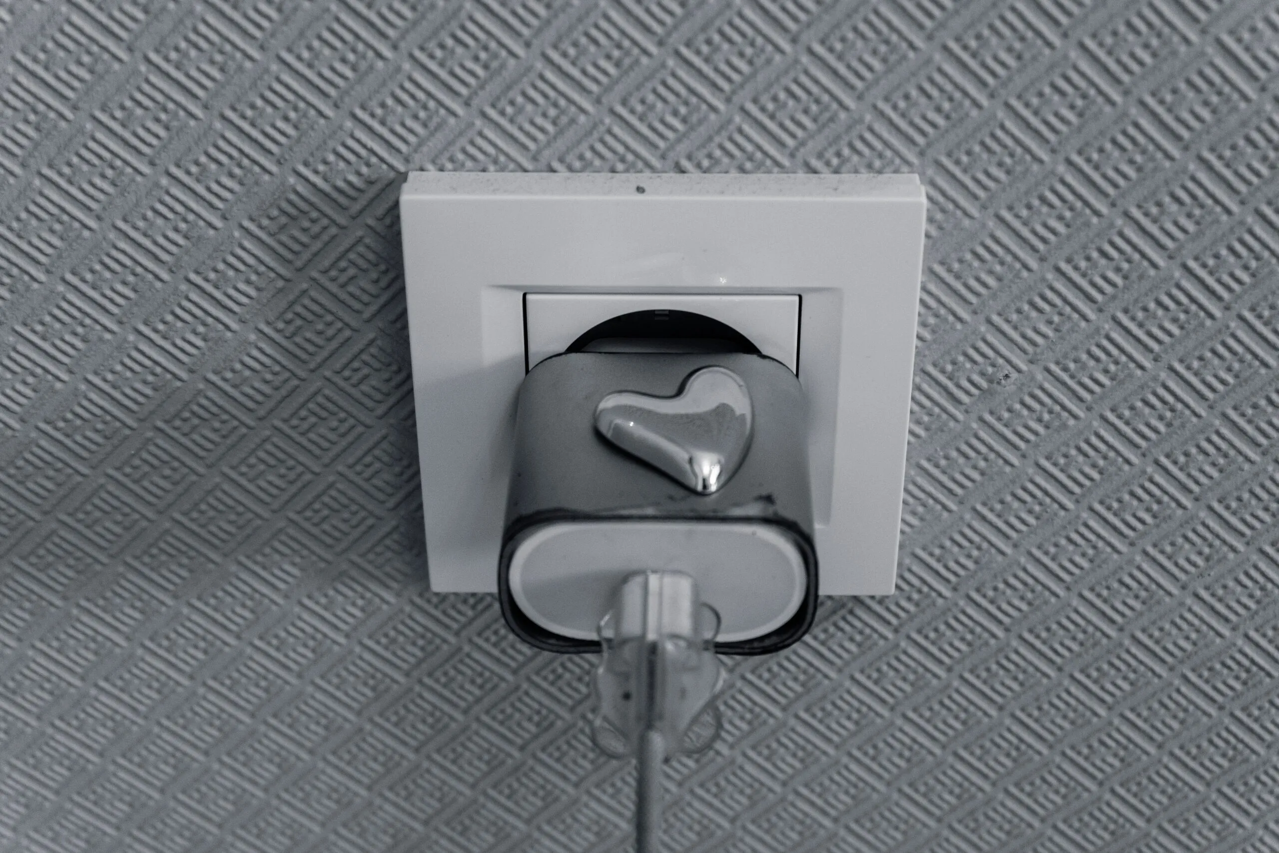 Electrical outlet with a heart-shaped plug
