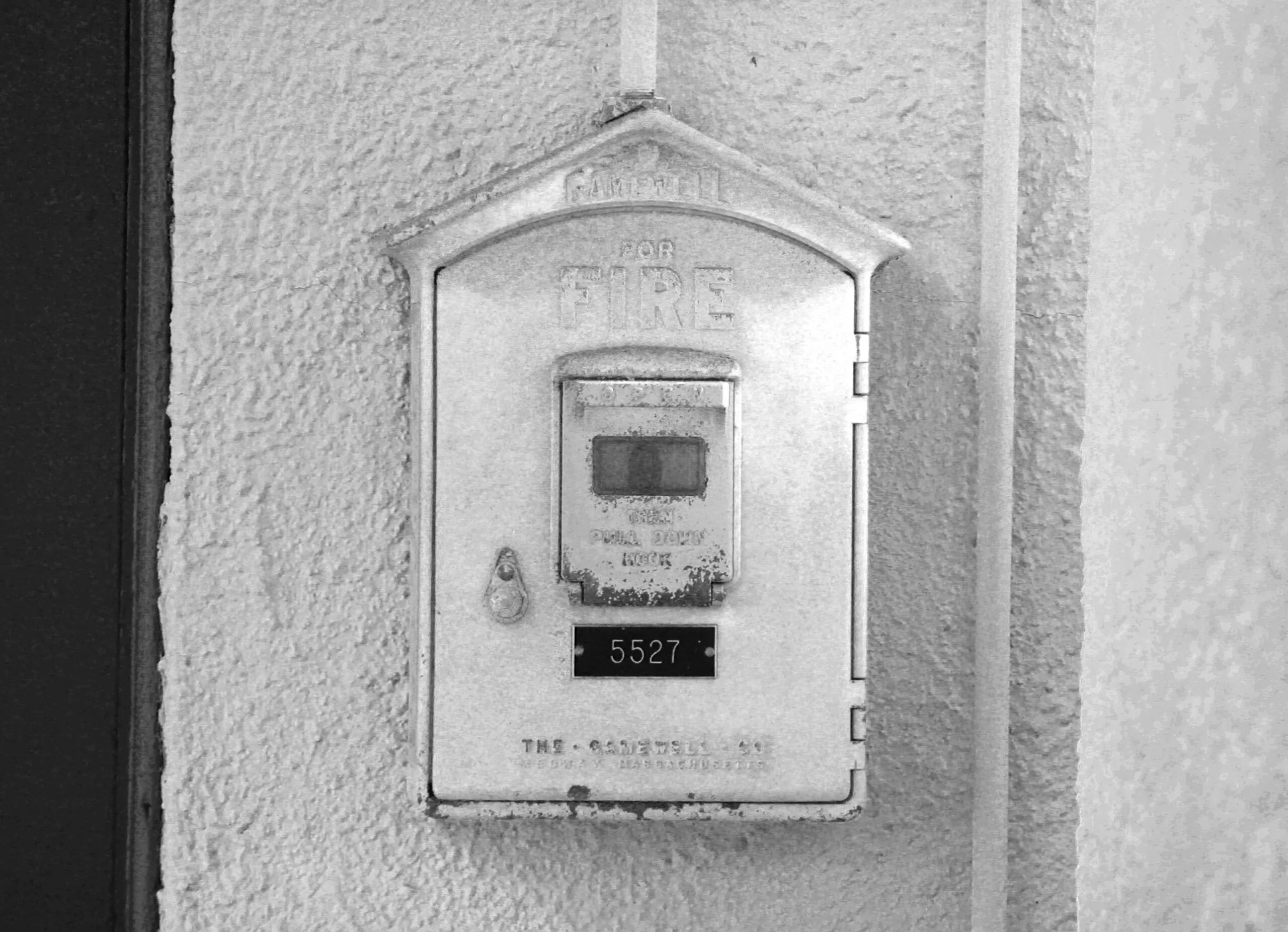 gray stainless steel fire exit sign