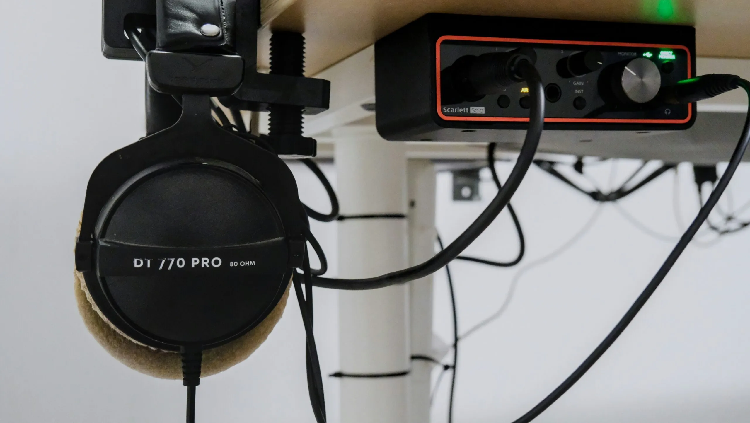Headphones and audio interface on a desk