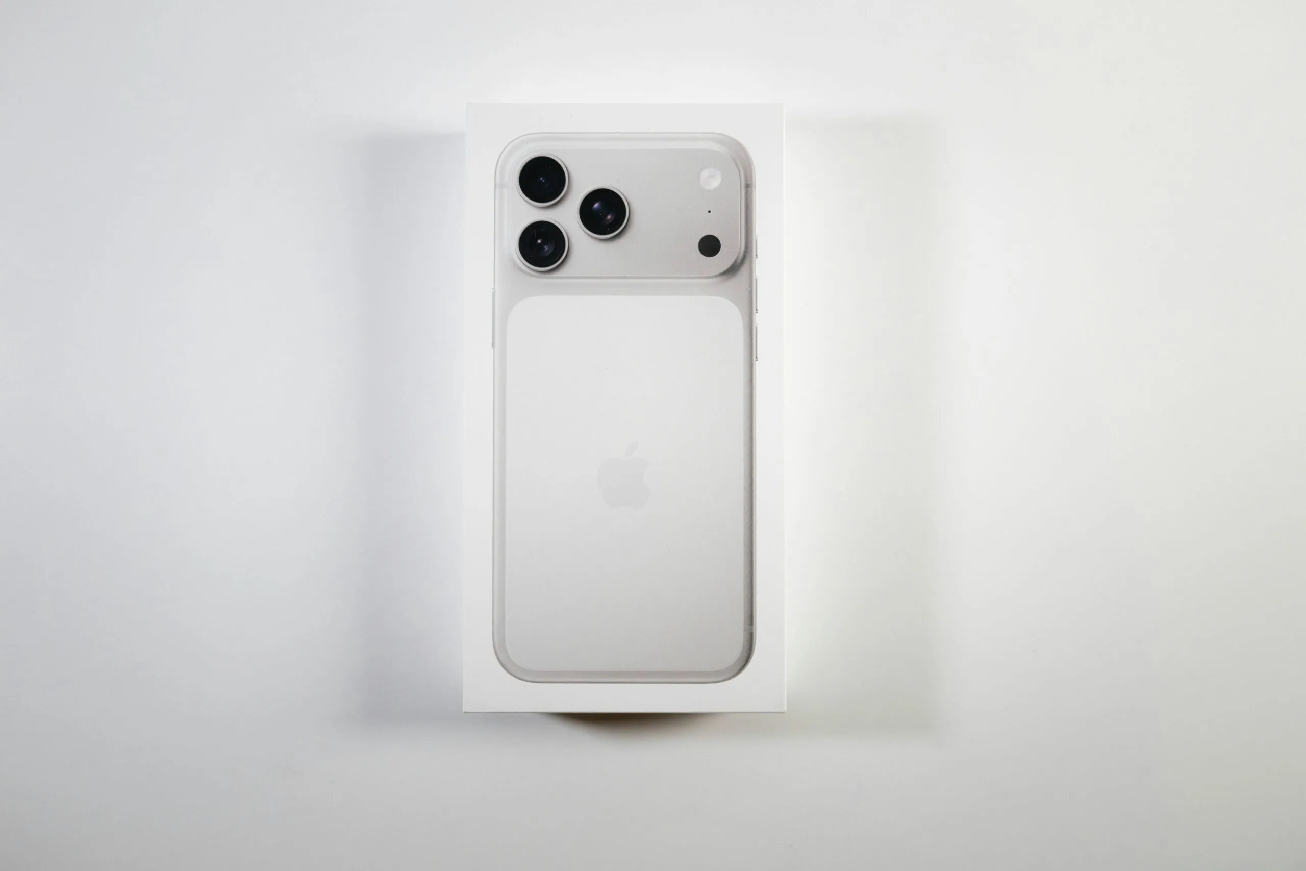 A white smartphone box with a phone inside