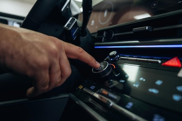 Pressing the button Man is sitting in car detailed view