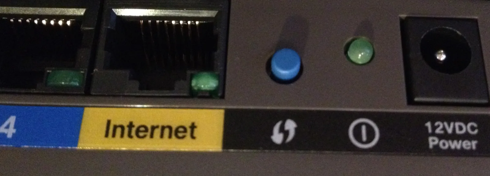 The w:Wi-Fi Protected Setup button (center, blue) on a Cisco E2500 wireless router, The WPS feature was shown in 2011 to break security of Wi-Fi encryption.