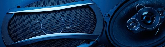 Black car sound speakers closeup on a black background audio system hard bass subwoofer