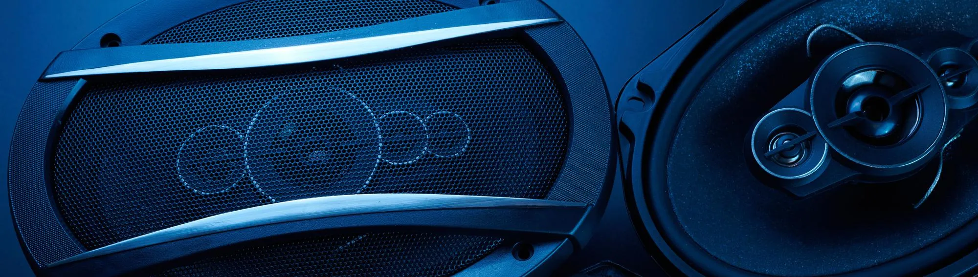 Black car sound speakers closeup on a black background audio system hard bass subwoofer