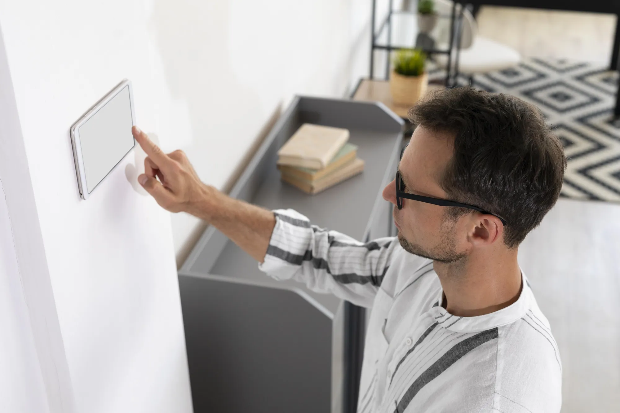 Man using a smart home tablet