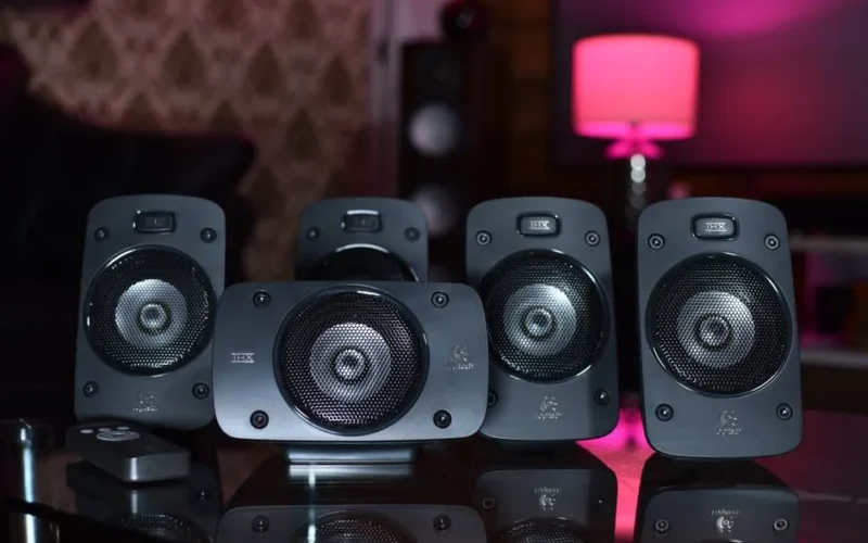 A close-up of a surround sound speaker system with remote, perfect for modern home entertainment.