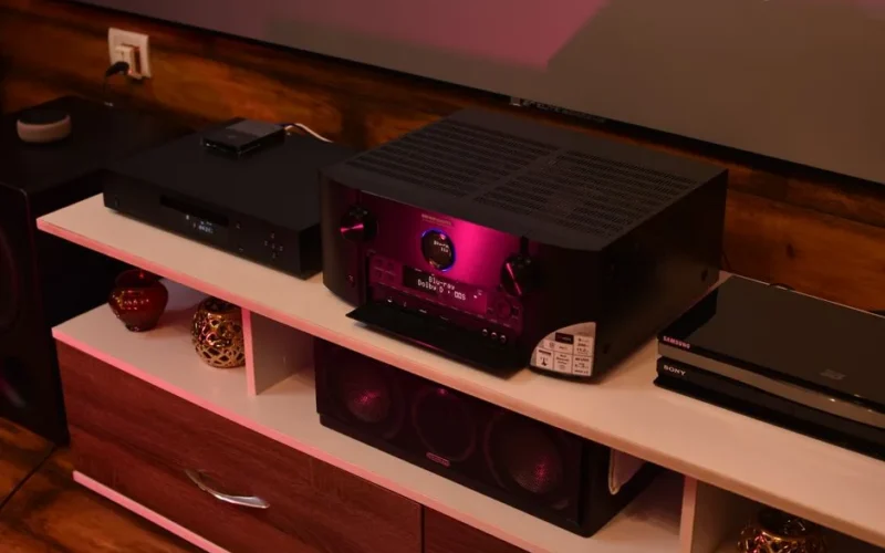 A sophisticated home theater setup featuring a modern amplifier surrounded by speakers, ideal for electrifying music experiences.