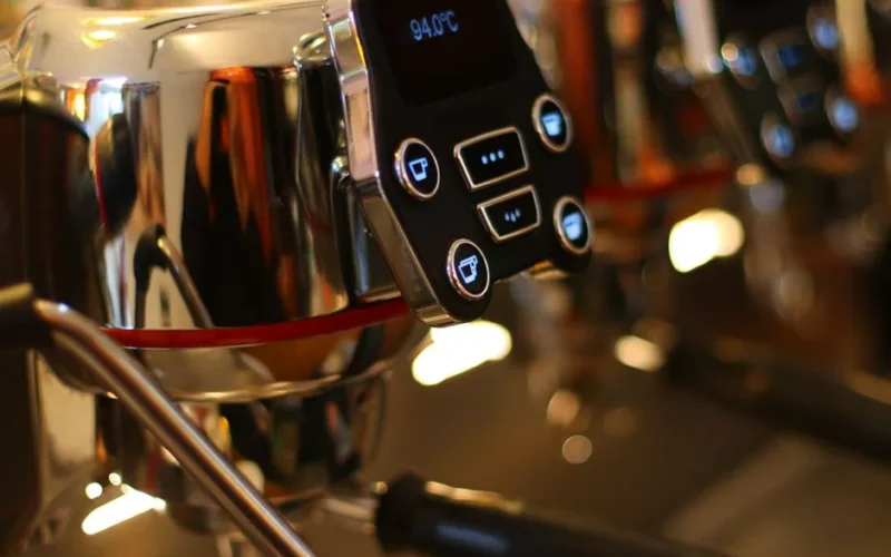 High-quality close-up shot of a modern espresso machine display showing temperature settings.