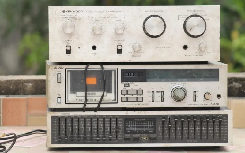 Retro stereo setup with vintage Kenwood amplifier and graphic equalizer on display.