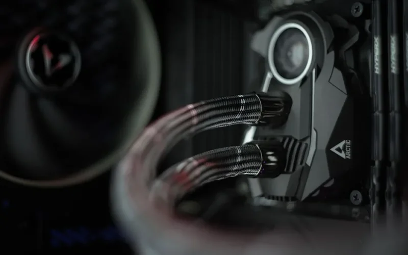 Detailed view of a liquid cooling system inside a desktop computer.