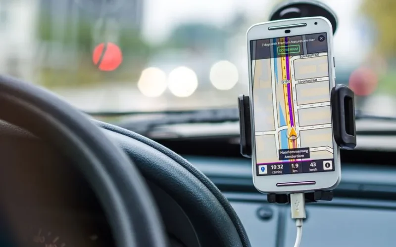 Smartphone mounted in car using GPS for navigation and directions.