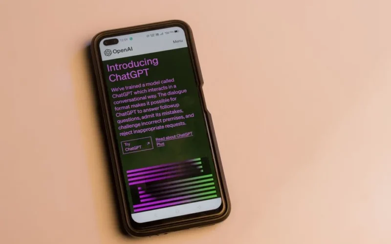 Smartphone screen showing ChatGPT introduction by OpenAI, showcasing AI technology.