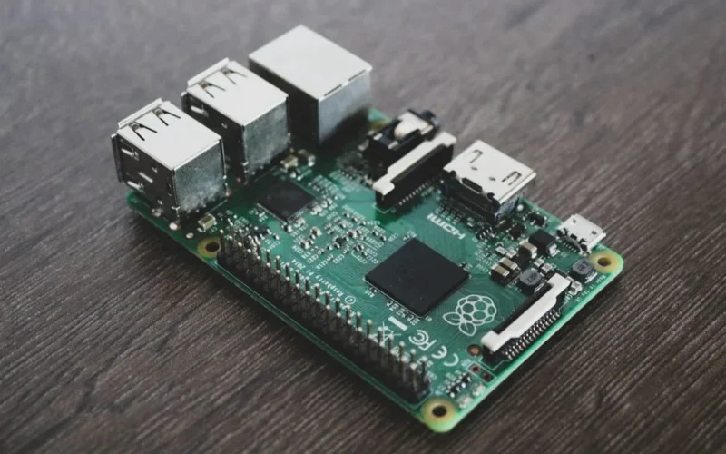 Detailed view of a Raspberry Pi circuit board with microchips and components.